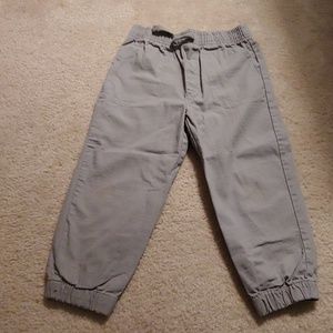 Gray pants with cuff at bottom and drawstring